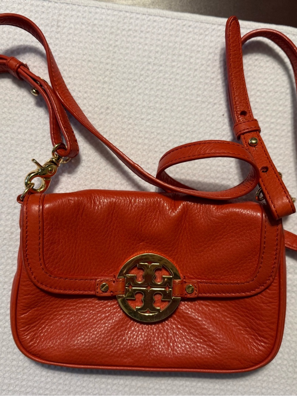 Tory Burch Red-Orange Pebbled Leather Crossbody with Logo Medallion